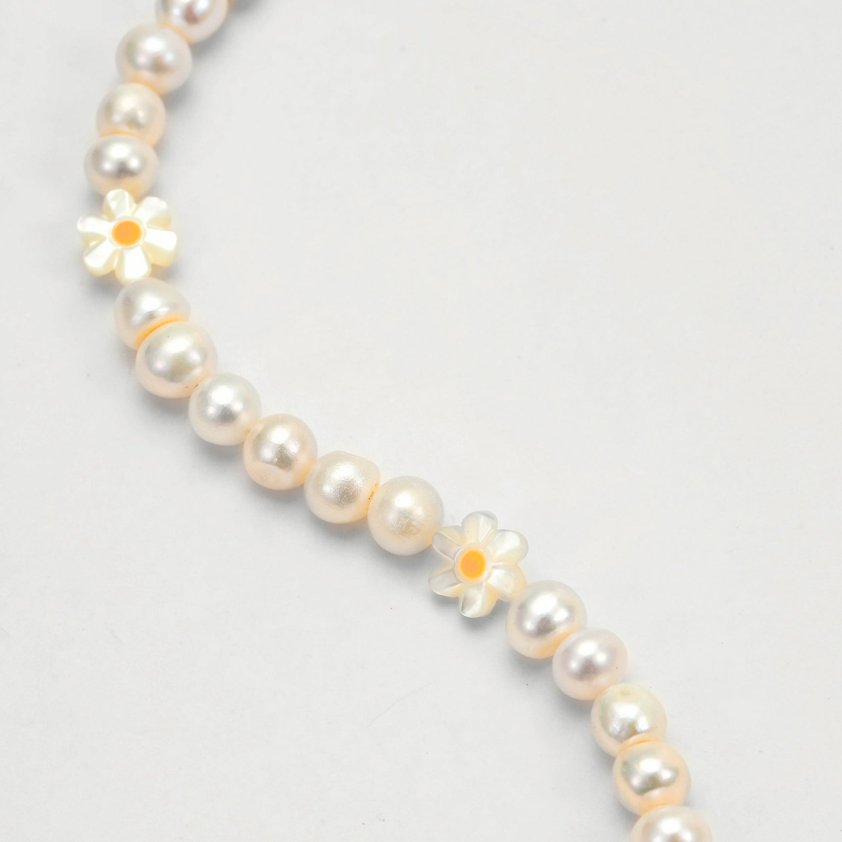 Electric Daisy Essential Pearl Chocker  close up photoshoot - yellow and white - Disco Eros Finos aka "DEF Jewelry" - Handmade freshwater pearl necklace