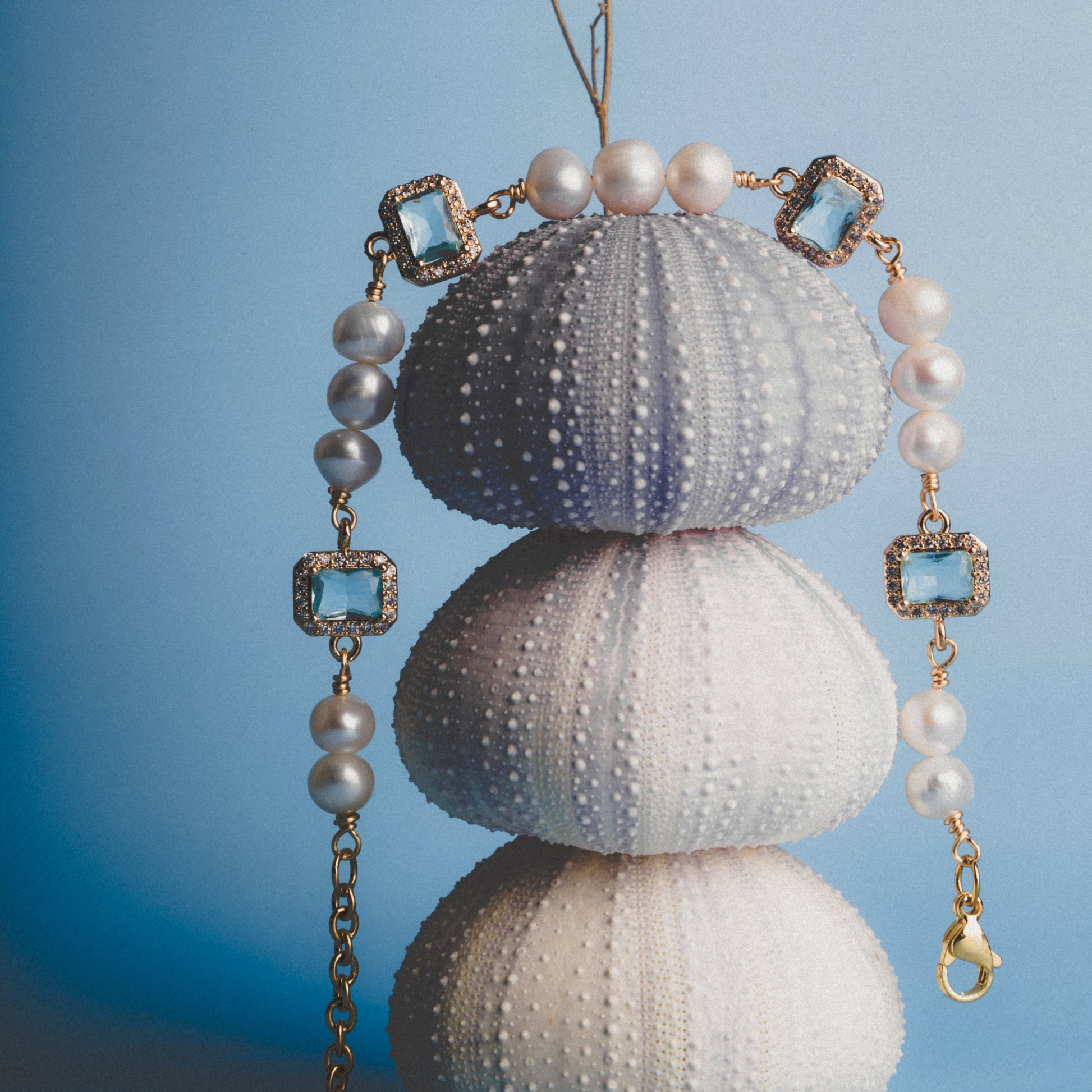 Editorial shoot of GEMS AND PEARLS SIGNATURE BRADED BRACELET - Disco Eros Finos -Handmade jewelry pearls crystal gems rings and chains (blue)