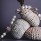 Editorial shoot of GEMS AND PEARLS SIGNATURE BRADED BRACELET - Disco Eros Finos -Handmade jewelry pearls crystal gems rings and chains (purple)