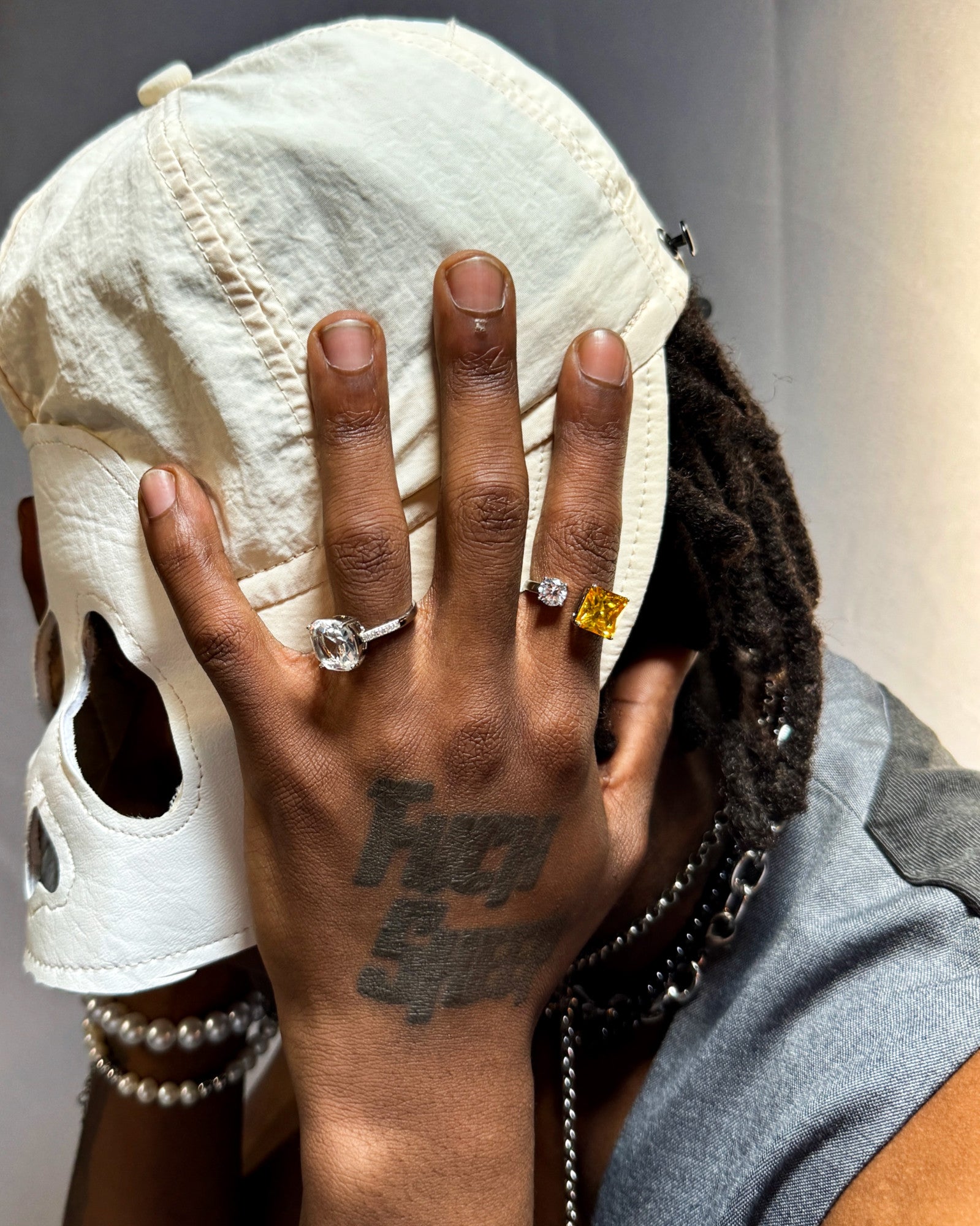 Close-up of a male model wearing Prism Arc Open Ring by Disco Eros Finos