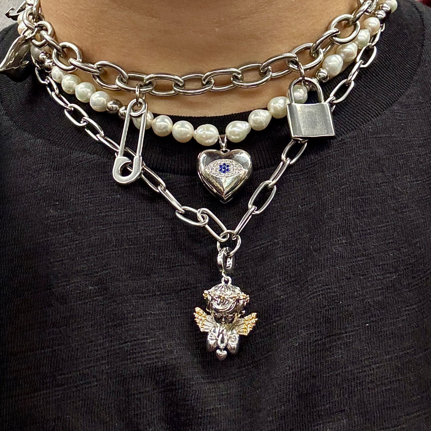 Model layering The Eros Necklace in silver by Disco Eros Finos with freshwater pearl choker and Dom Dolla heavy-weight chain - Handmade by DEF Jewelry